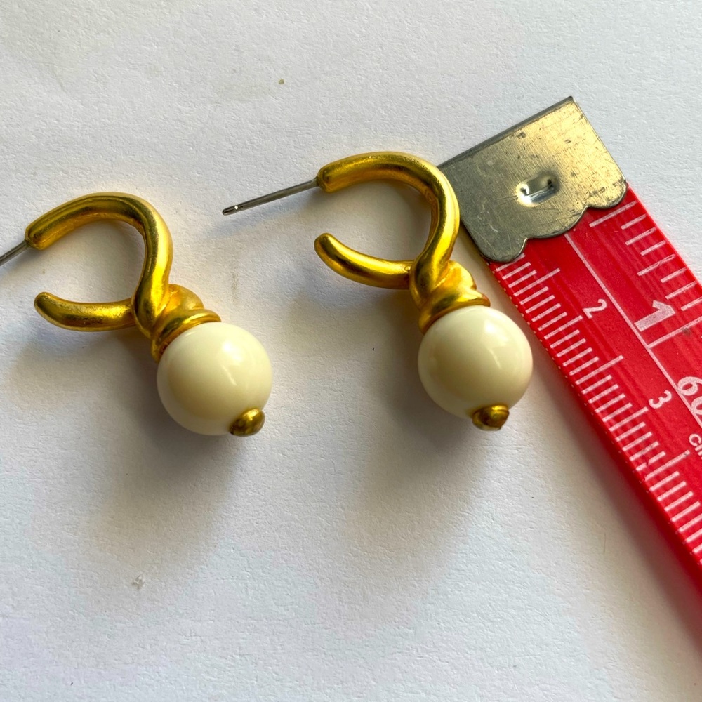 Earrings-twisted Gold hoop 1/4" pierced. Dangling ivory ball 1-1/4". Versatile.